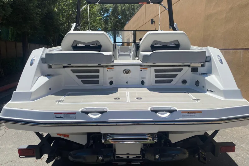 Slide: The Image of 2025 Scarab 235 SE boat rear view, showcasing sleek design and spacious seating. - 6