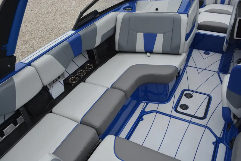 Slide: The Image of 2022 Malibu Wakesetter 23 LSV interior with blue and gray seating and stylish design. - 11