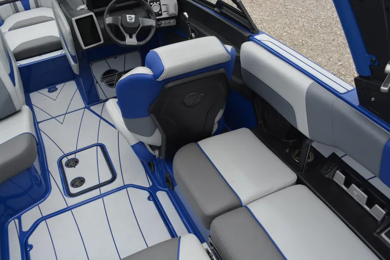 Slide: The Image of Interior of 2022 Malibu Wakesetter 23 LSV boat with blue and gray seating. - 12