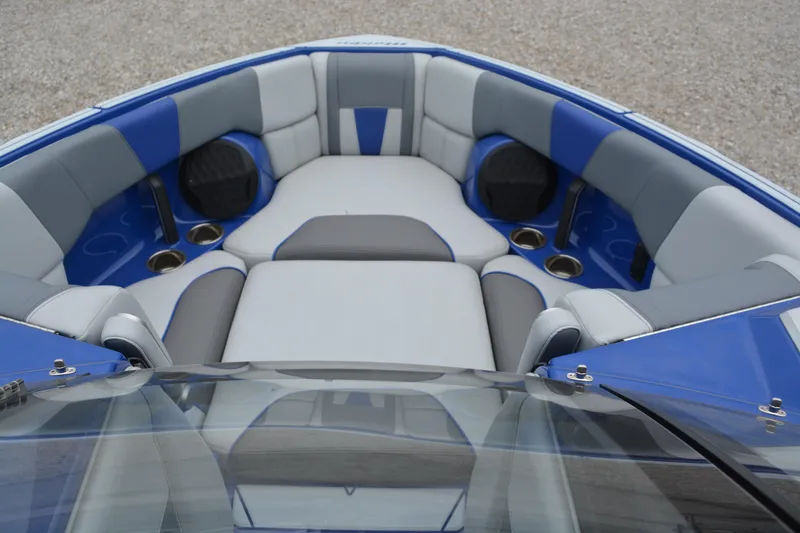 Slide: The Image of 2022 Malibu Wakesetter 23 LSV boat interior with blue and gray seating. - 15