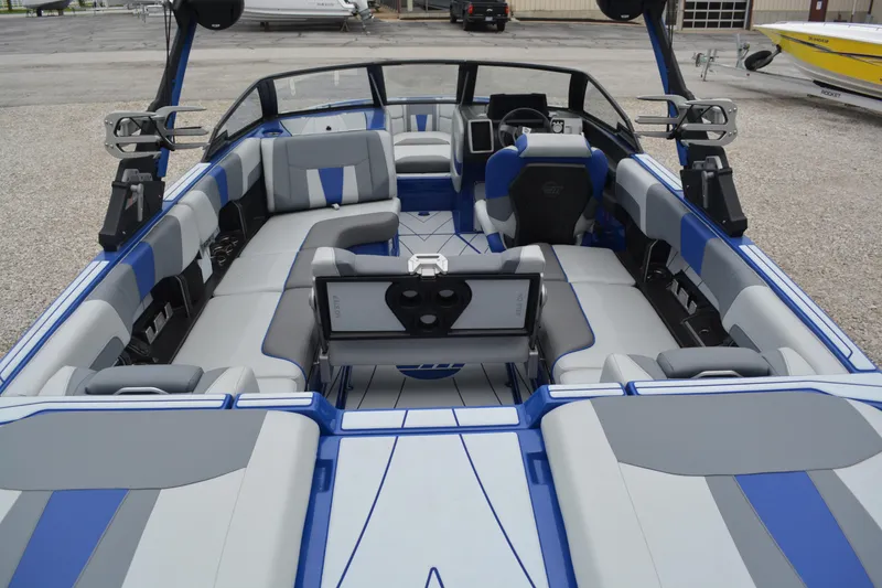 Slide: The Image of 2022 Malibu Wakesetter 23 LSV interior with blue and gray seating, showcasing luxury design. - 8
