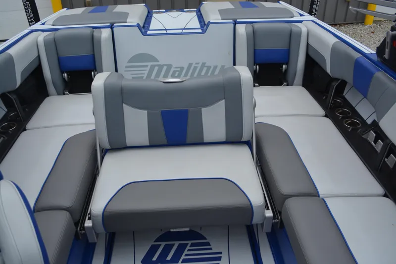 Slide: The Image of 2022 Malibu Wakesetter 23 LSV interior with gray and blue seating arrangement. - 9