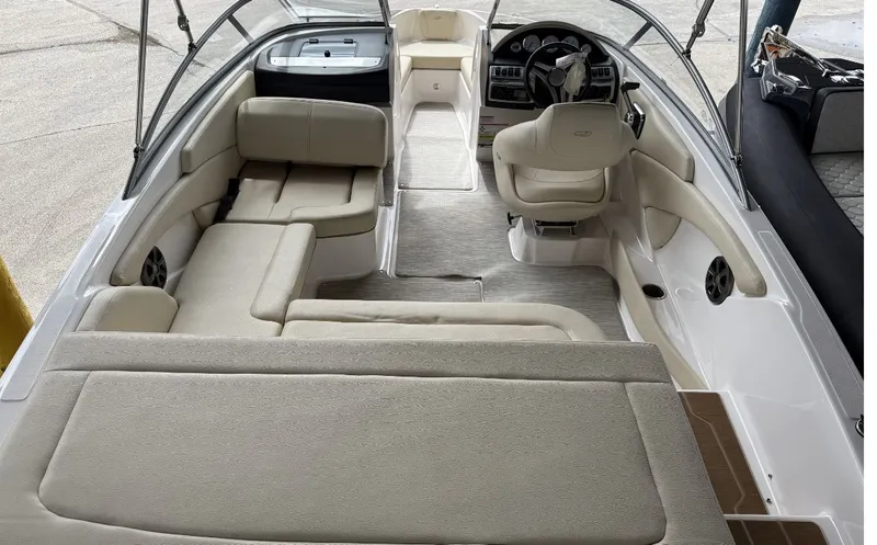 Slide: The Image of Interior of a 2019 Regal 1900 ES Bowrider with beige seating. - 2