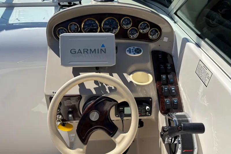 Slide: The Image of 2002 Rinker Fiesta Vee 270 helm with Garmin GPS and control panel. - 10