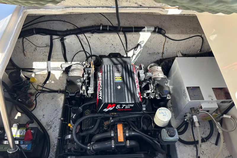 Slide: The Image of Engine compartment of a 2002 Rinker Fiesta Vee 270 with a 5.7L Mercury engine. - 19