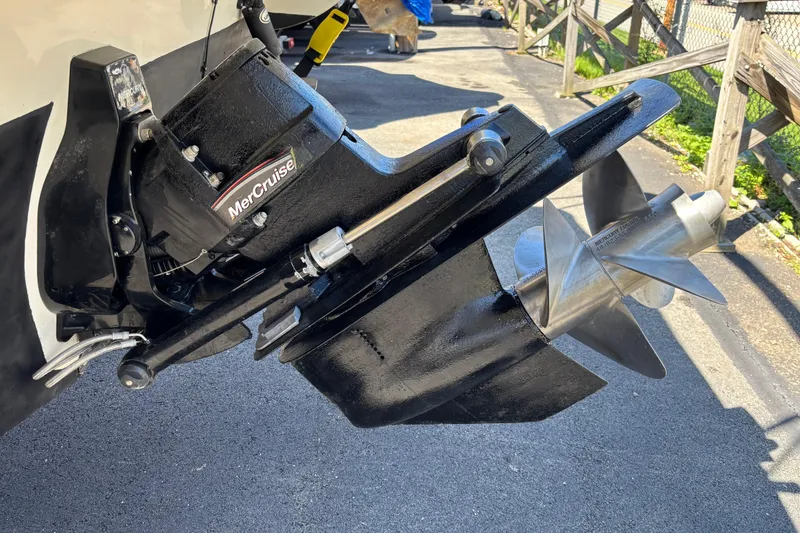 Slide: The Image of Close-up of a 2002 Rinker Fiesta Vee 270 boat's MerCruiser outdrive and propeller. - 5