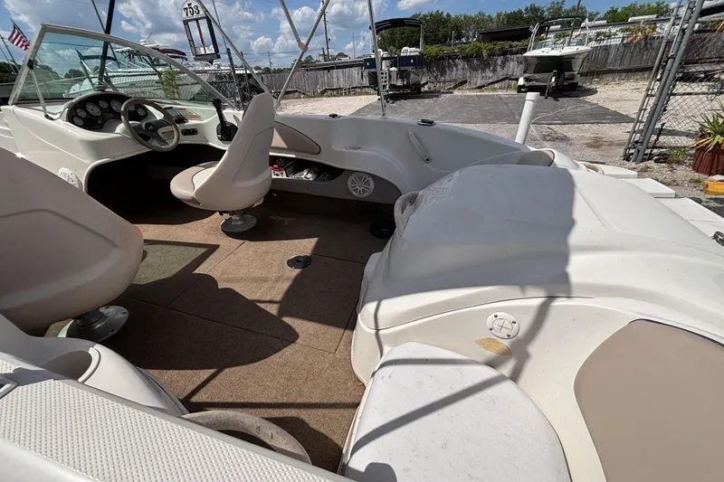 Slide: The Image of Interior of a 2002 Sea Ray 176 Bow Rider boat with seating and dashboard. - 14