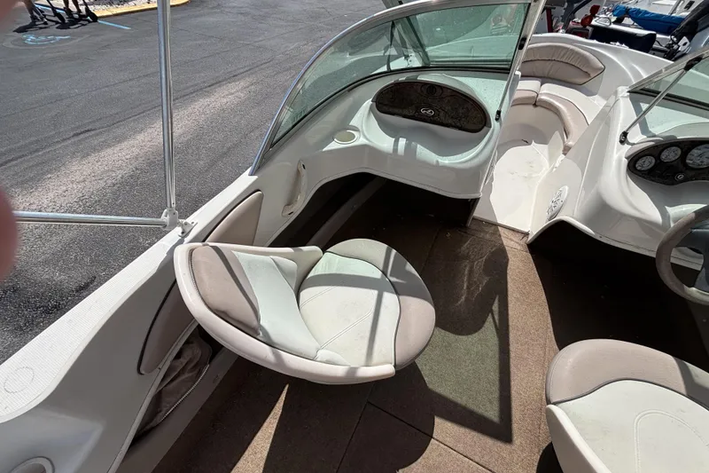 Slide: The Image of 2002 Sea Ray 176 Bow Rider interior with seating and dashboard view. - 18