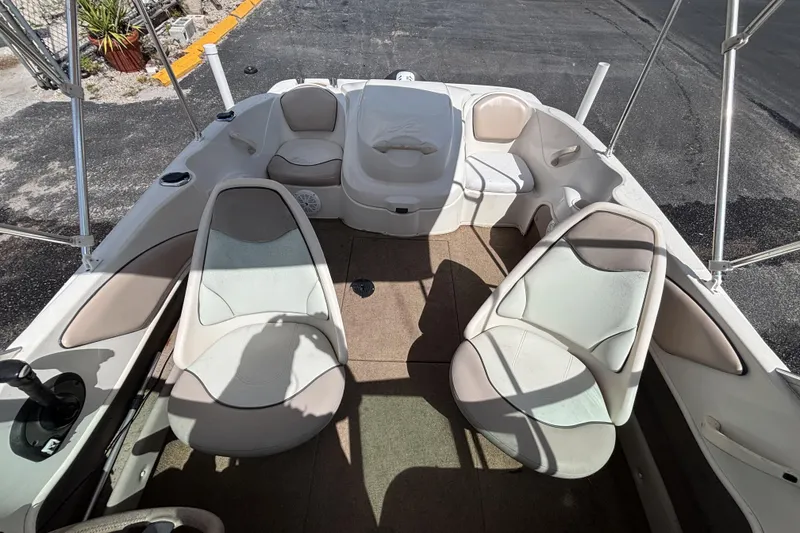 Slide: The Image of 2002 Sea Ray 176 Bow Rider interior with seating and open deck layout. - 29