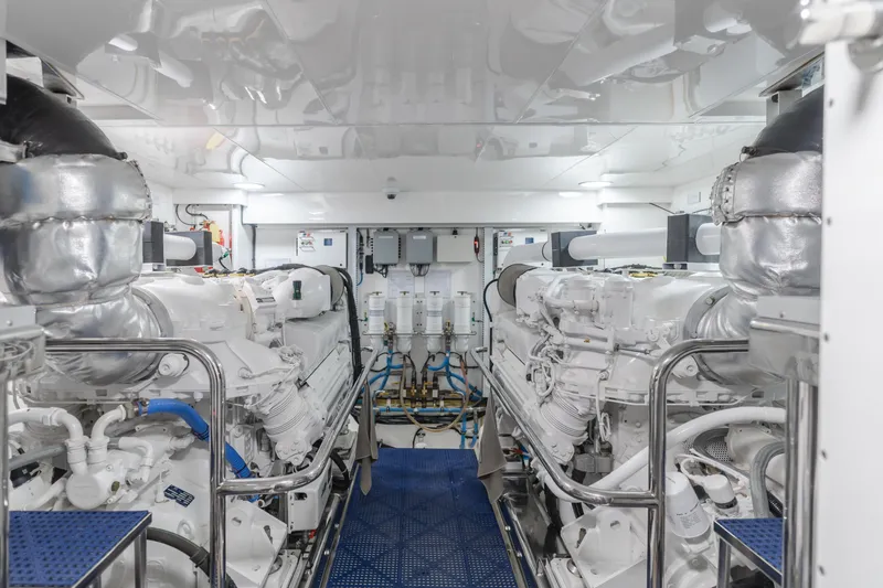Slide: The Image of Engine room of 2015 Ocean Alexander 72 Pilothouse yacht, featuring dual engines and modern equipment. - 10