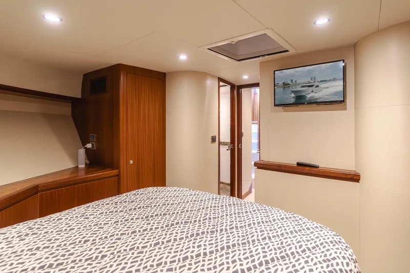 Slide: The Image of Luxurious bedroom interior of 2015 Ocean Alexander 72 Pilothouse yacht with TV and modern decor. - 16