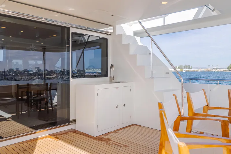 Slide: The Image of Luxurious 2015 Ocean Alexander 72 Pilothouse yacht deck with seating and ocean view. - 35