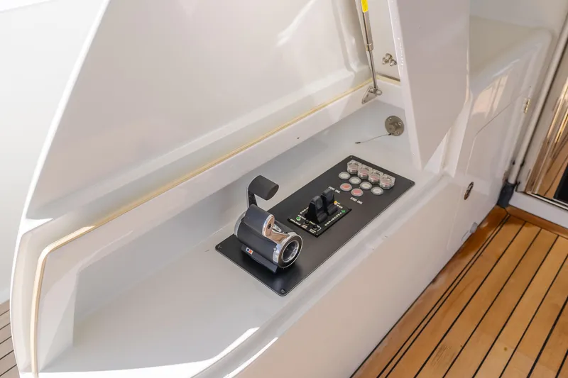 Slide: The Image of Control panel on 2015 Ocean Alexander 72 Pilothouse yacht with wooden deck. - 38