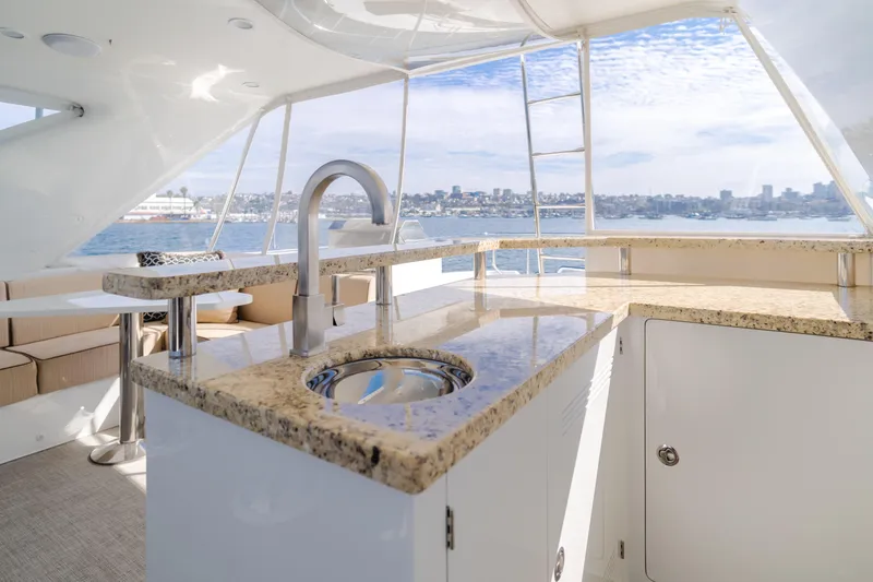 Slide: The Image of Luxurious 2015 Ocean Alexander 72 Pilothouse yacht interior with granite countertop and ocean view. - 45