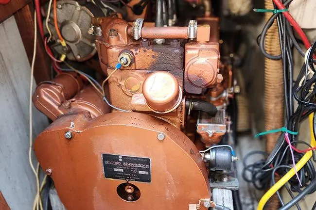 Slide: The Image of 1977 C&C 29 boat engine with visible wiring and components. - 12