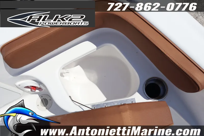 Slide: The Image of 2026 ALK2 Powerboats 18 CRS Center Console interior with brown seating and cup holder. - 13