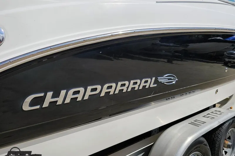 Slide: The Image of 2007 Chaparral 256 SSi boat side view with logo and trailer. - 10