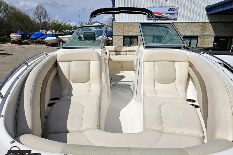 Slide: The Image of 2007 Chaparral 256 SSi boat interior with beige seating and open windshield. - 16