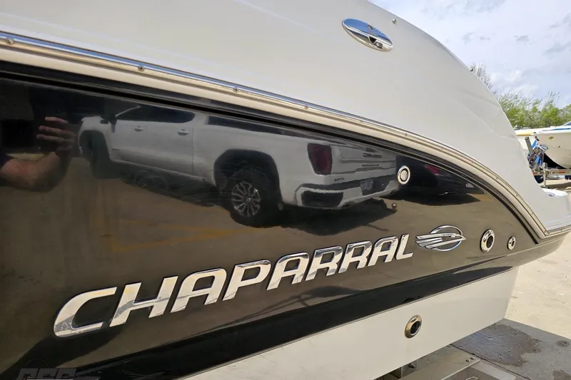Slide: The Image of 2007 Chaparral 256 SSi boat with reflective black hull and logo. - 23