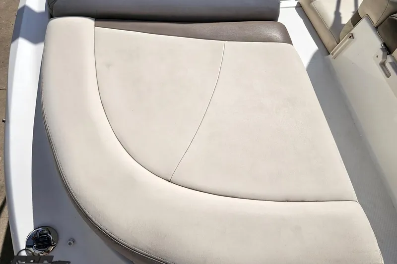 Slide: The Image of 2007 Chaparral 256 SSi boat interior with beige cushioned seating. - 31