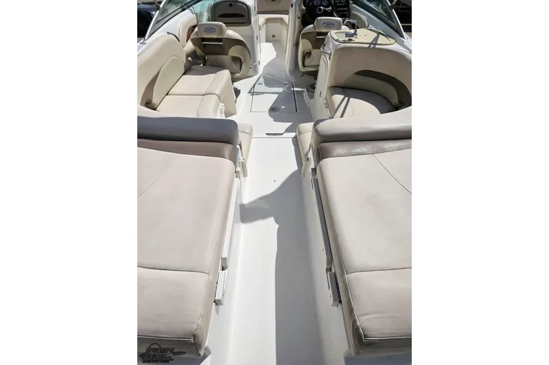 Slide: The Image of Interior view of 2007 Chaparral 256 SSi boat with beige seating and steering console. - 35
