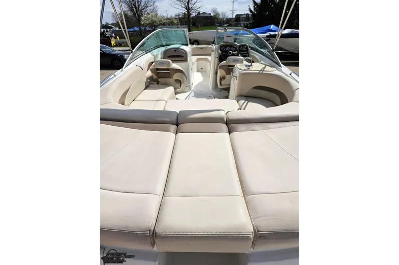 Slide: The Image of 2007 Chaparral 256 SSi boat interior with beige seating and modern dashboard. - 38