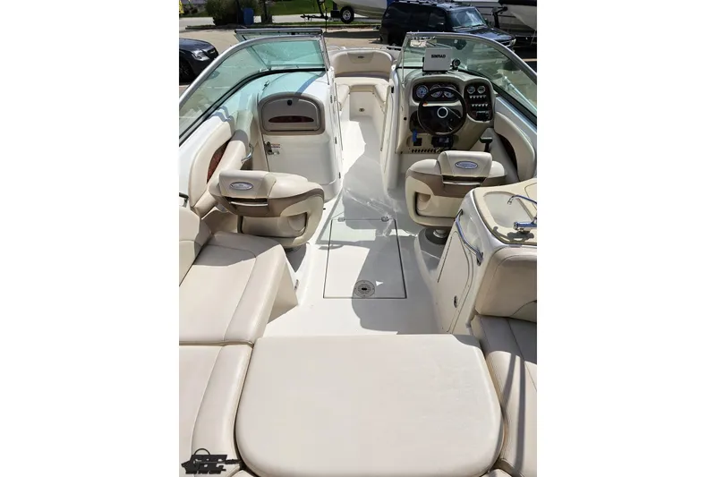 Slide: The Image of 2007 Chaparral 256 SSi boat interior with beige seating and modern dashboard. - 41