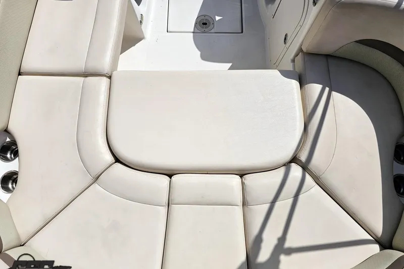 Slide: The Image of 2007 Chaparral 256 SSi boat interior with beige cushioned seating. - 42
