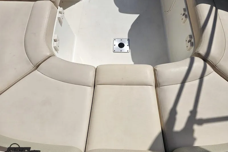 Slide: The Image of 2007 Chaparral 256 SSi boat interior with beige seating and central mount. - 45