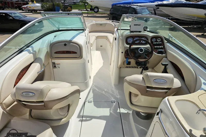Slide: The Image of 2007 Chaparral 256 SSi boat interior with steering wheel, dashboard, and seating. - 46