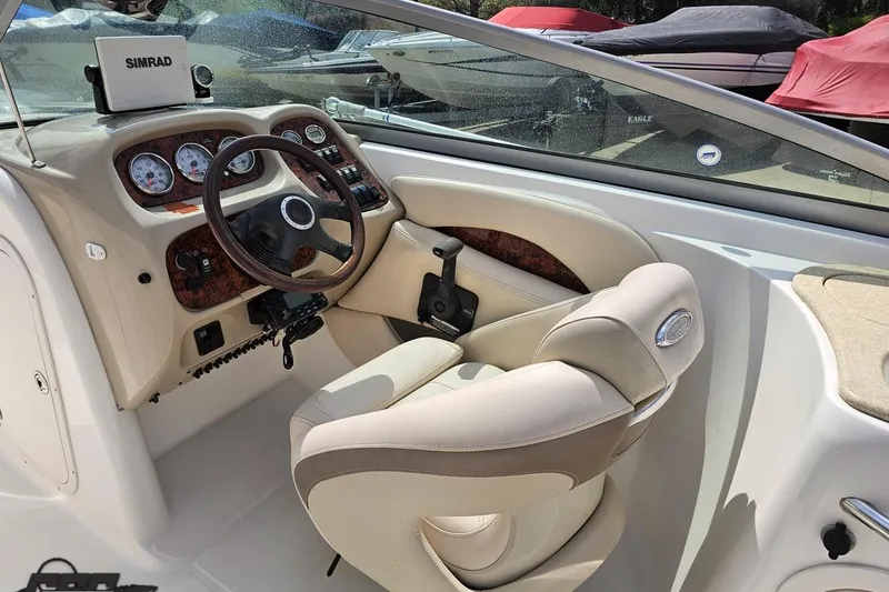 Slide: The Image of 2007 Chaparral 256 SSi boat interior with steering wheel and dashboard controls. - 52