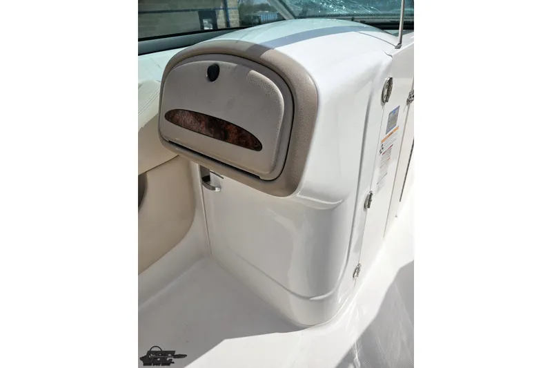 Slide: The Image of 2007 Chaparral 256 SSi boat interior with storage compartment and sleek design. - 55
