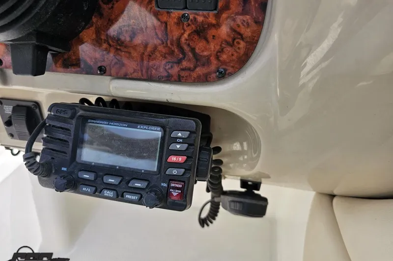 Slide: The Image of 2007 Chaparral 256 SSi boat dashboard with Standard Horizon Explorer GPS radio. - 62