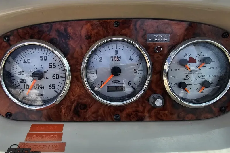 Slide: The Image of Dashboard of a 2007 Chaparral 256 SSi boat with speedometer and RPM gauges. - 64