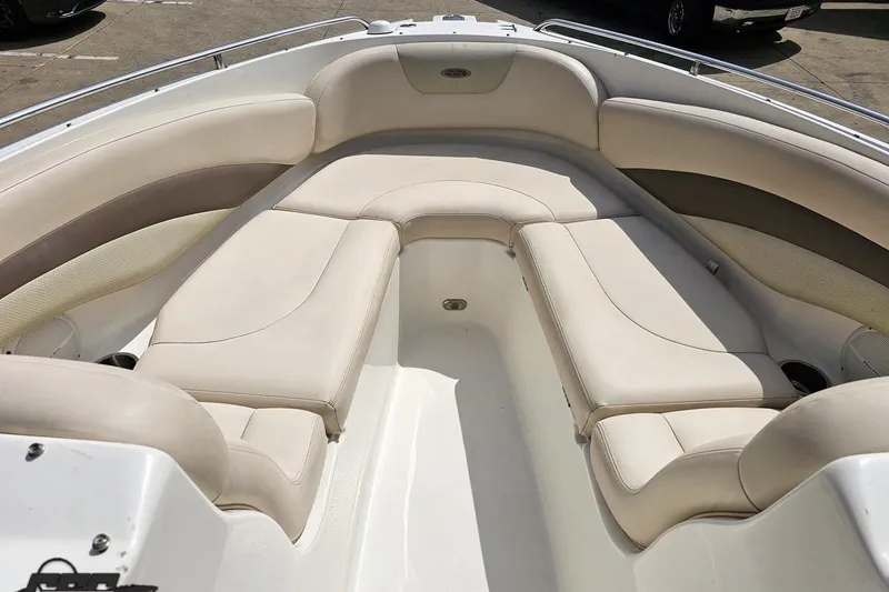 Slide: The Image of 2007 Chaparral 256 SSi boat interior with beige seating and spacious layout. - 69