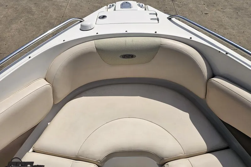 Slide: The Image of 2007 Chaparral 256 SSi boat interior with beige seating and stainless steel railings. - 72
