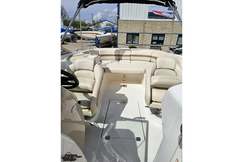 Slide: The Image of 2007 Chaparral 256 SSi boat interior with beige seating and open deck. - 78