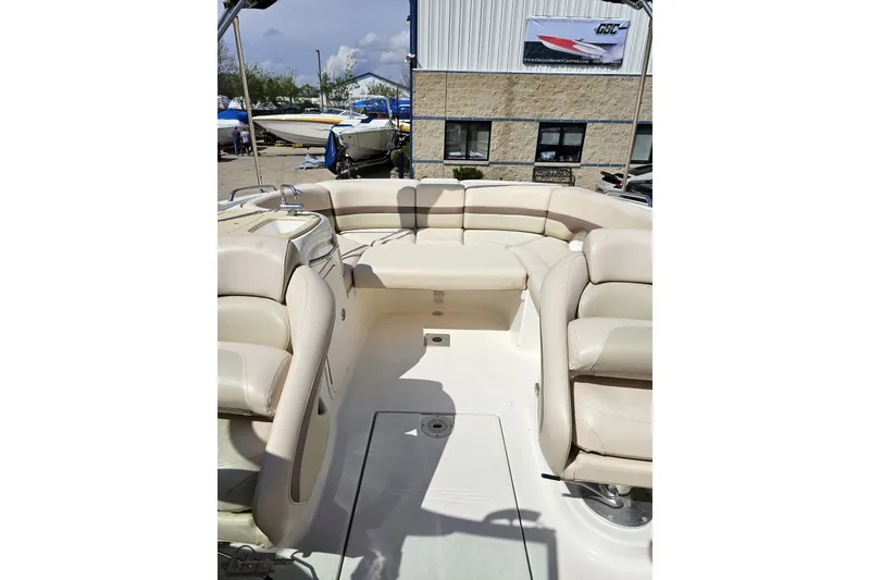 Slide: The Image of 2007 Chaparral 256 SSi boat interior with beige seating and spacious layout. - 79