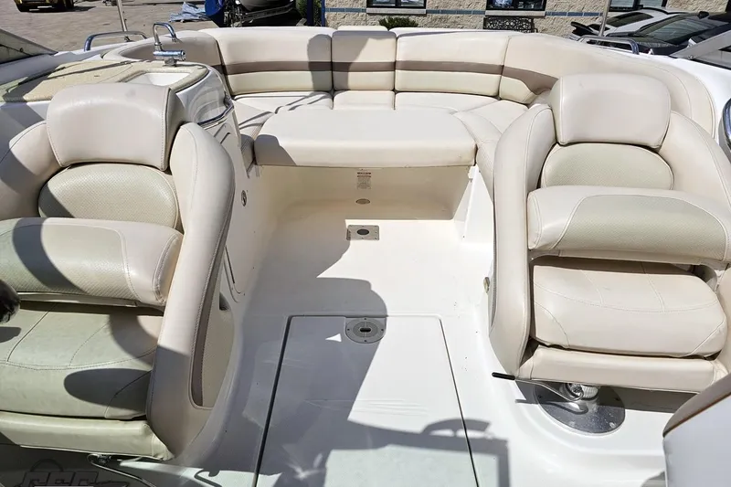 Slide: The Image of 2007 Chaparral 256 SSi boat interior with beige seating and spacious layout. - 80