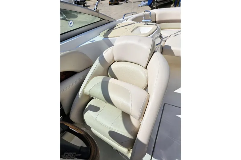 Slide: The Image of 2007 Chaparral 256 SSi boat interior with beige seating and a small sink area. - 81