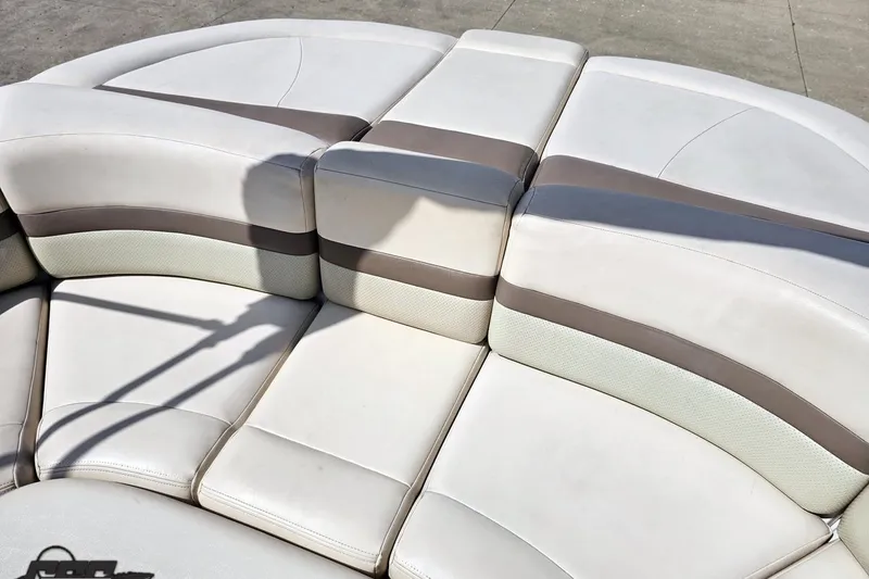Slide: The Image of 2007 Chaparral 256 SSi boat seating with beige and brown upholstery. - 85