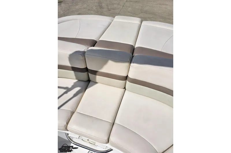 Slide: The Image of 2007 Chaparral 256 SSi boat seating with beige and gray upholstery. - 86