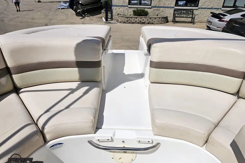 Slide: The Image of 2007 Chaparral 256 SSi boat interior with beige seating and white deck. - 88