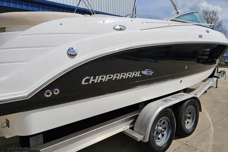 Slide: The Image of 2007 Chaparral 256 SSi boat on trailer, side view, white and black exterior. - 9