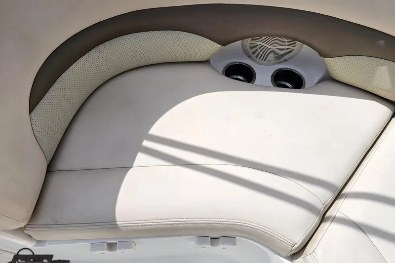 Slide: The Image of 2007 Chaparral 256 SSi boat interior seating with cup holders and speaker. - 90