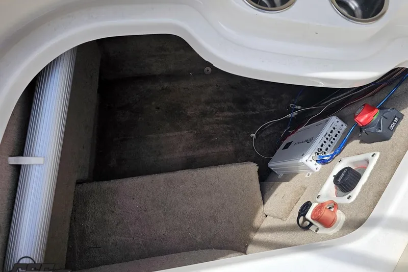 Slide: The Image of Interior view of a 2007 Chaparral 256 SSi boat showing wiring and components. - 91