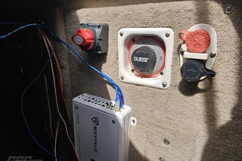 Slide: The Image of Electrical panel in a 2007 Chaparral 256 SSi boat with switches and wiring. - 92