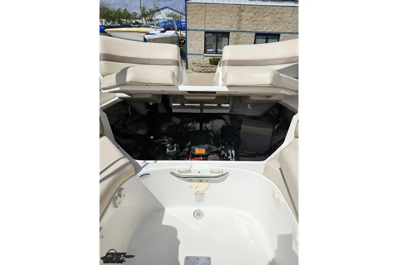Slide: The Image of 2007 Chaparral 256 SSi boat engine compartment with open seating area. - 94