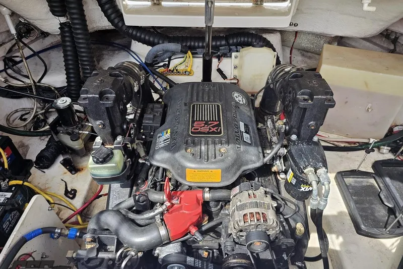 Slide: The Image of Engine compartment of a 2007 Chaparral 256 SSi boat, featuring a Volvo Penta 5.7 OSXi engine. - 95