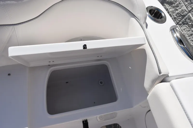 Slide: The Image of Open storage compartment on 2026 Sea Hunt Ultra 275 SE boat interior. - 24